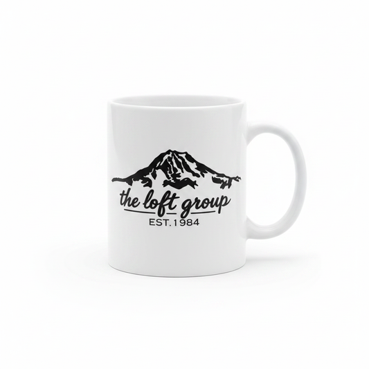 The Loft Group Est. 1984 white coffee mug with black mountain graphic